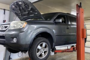 SUV on lift during inspection at Enright Automotive in Alexandria, OH, Preventative Maintenance In Alexandria, OH At Enright Automotive