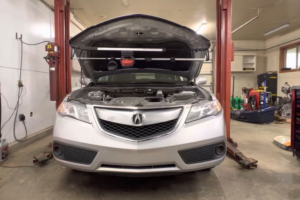 National Car Care Month Service in Alexandria, OH at Enright Automotive. Close-up view of a vehicle with the hood open during Car Care Month inspection and maintenance