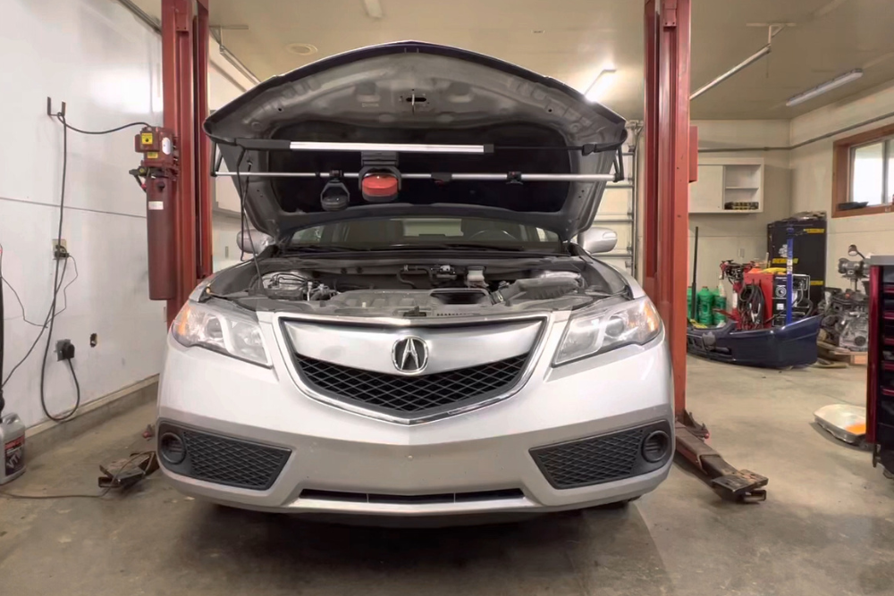 National Car Care Month Service in Alexandria, OH at Enright Automotive. Close-up view of a vehicle with the hood open during Car Care Month inspection and maintenance